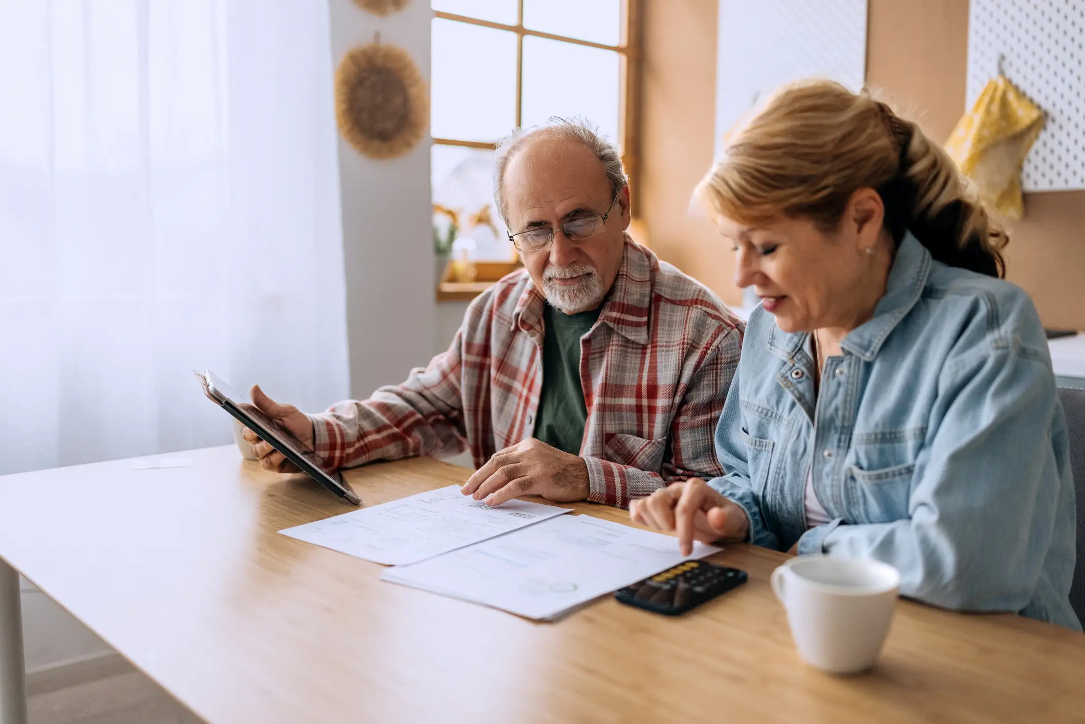 iStock-2206045180-JulyBlogFeaturedImage Senior couple reviewing their finances